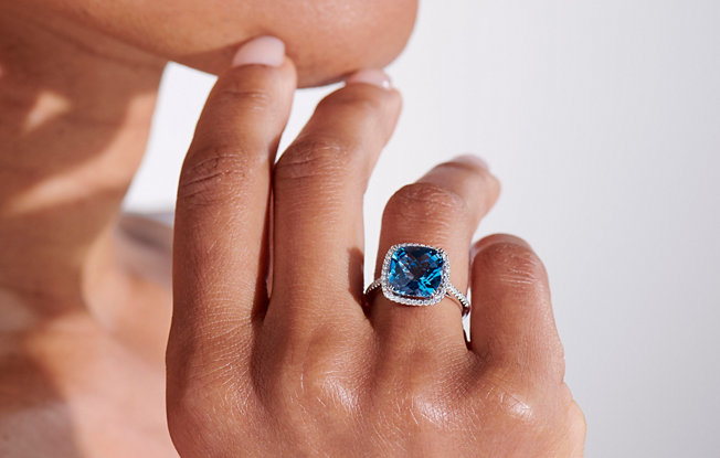 A sparkling topaz diamond halo ring