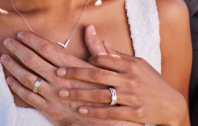Close up of a couple's hands as they embrace 