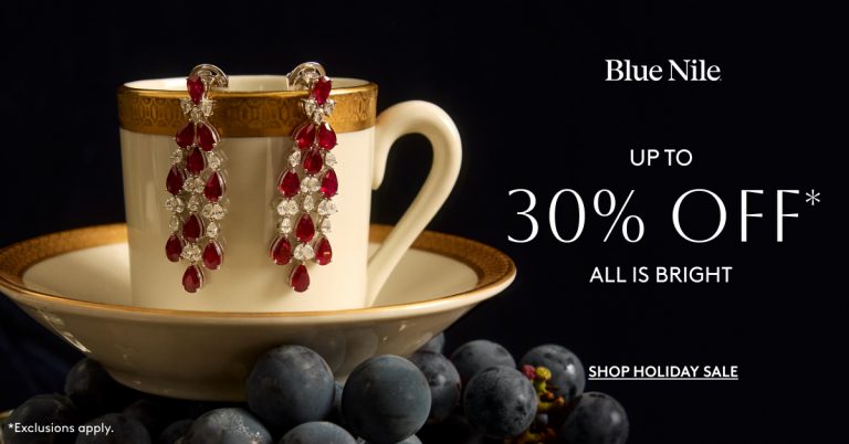 Holiday jewelry displayed on a cup