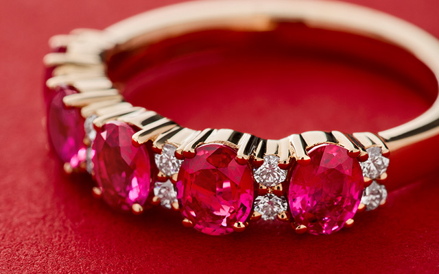 Close up of a ruby ring with accent diamonds
