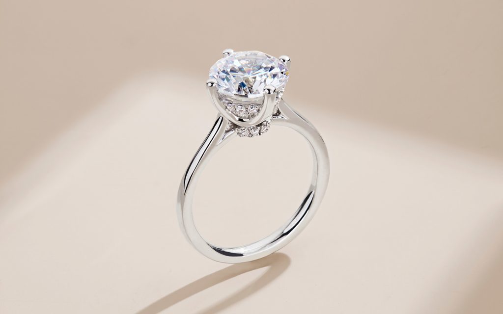 Hidden halo engagement ring in white gold with natural diamonds. 