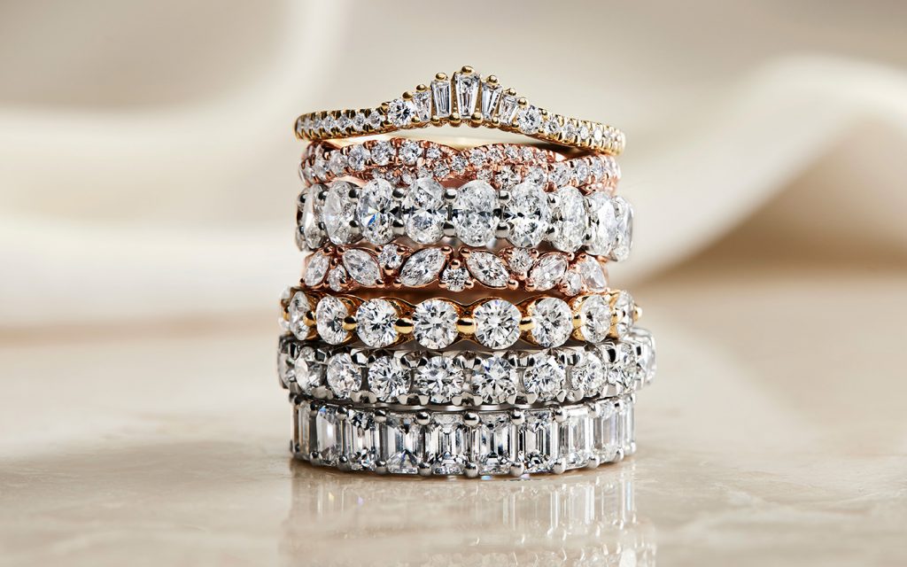 Stack of diamond and gold wedding rings. 