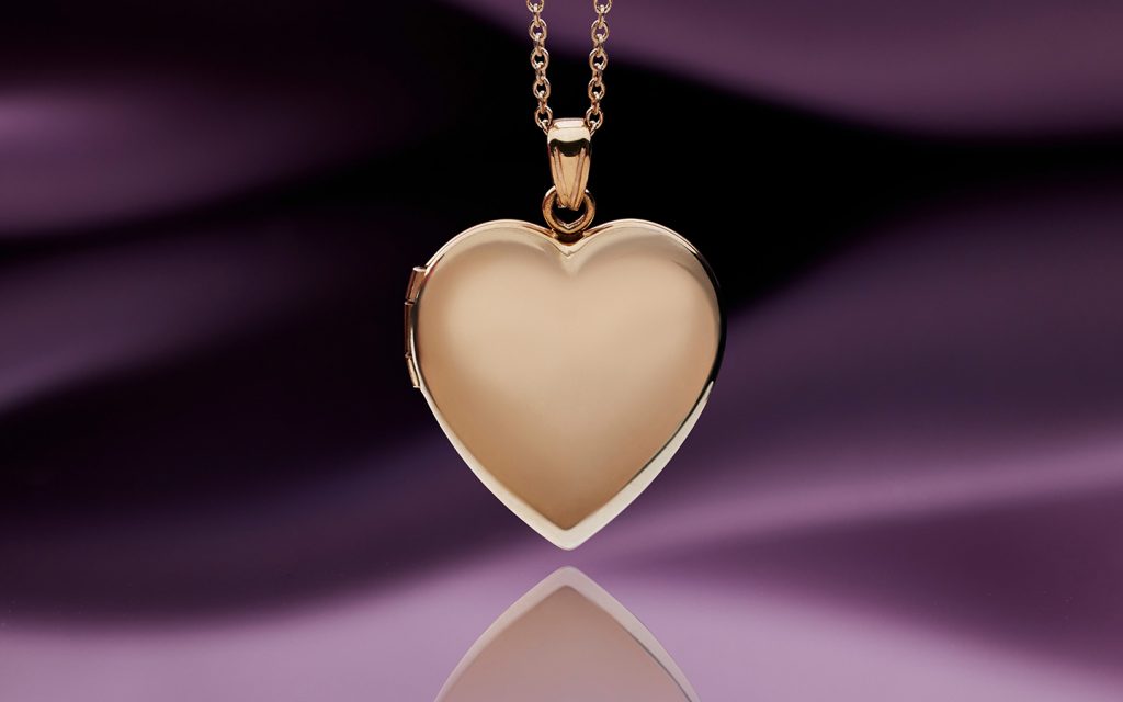 Rose gold heart locket close up.