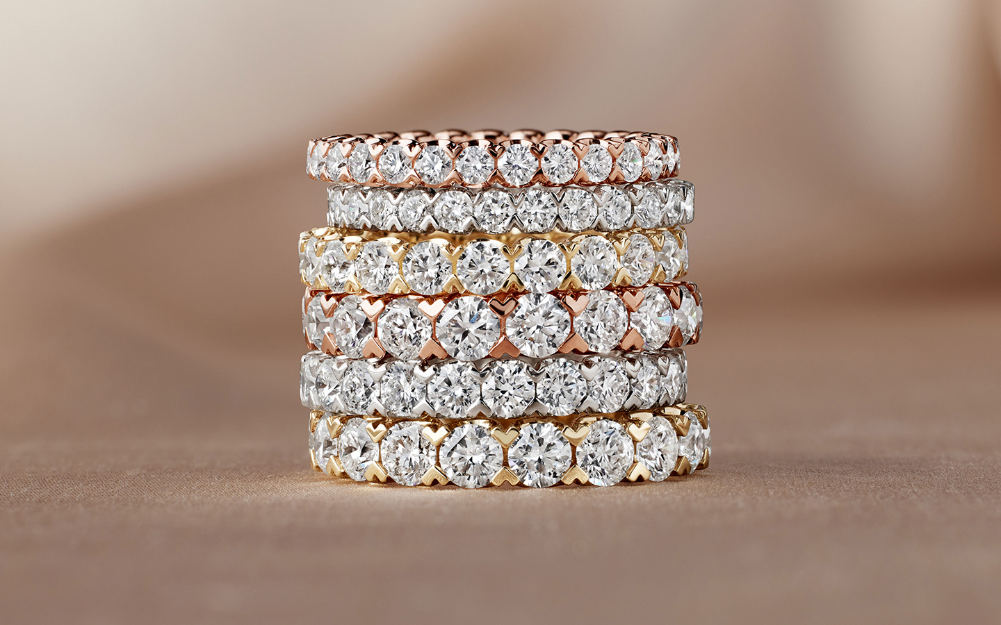 Wedding bands in yellow gold, rose gold and white gold all with diamonds.