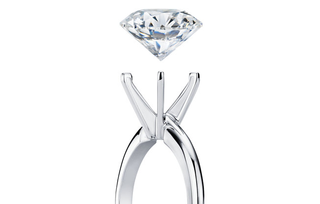 Diamond floating above an engagement ring setting 