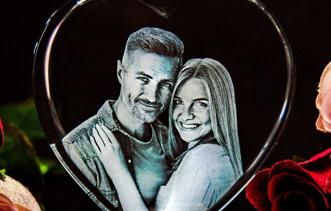 A heart shaped 3D crystal featuring a photo of a couple embracing