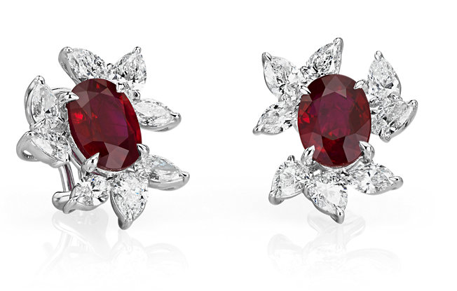 Oval Ruby Earrings with Diamond Leaf Halos displayed on a white background