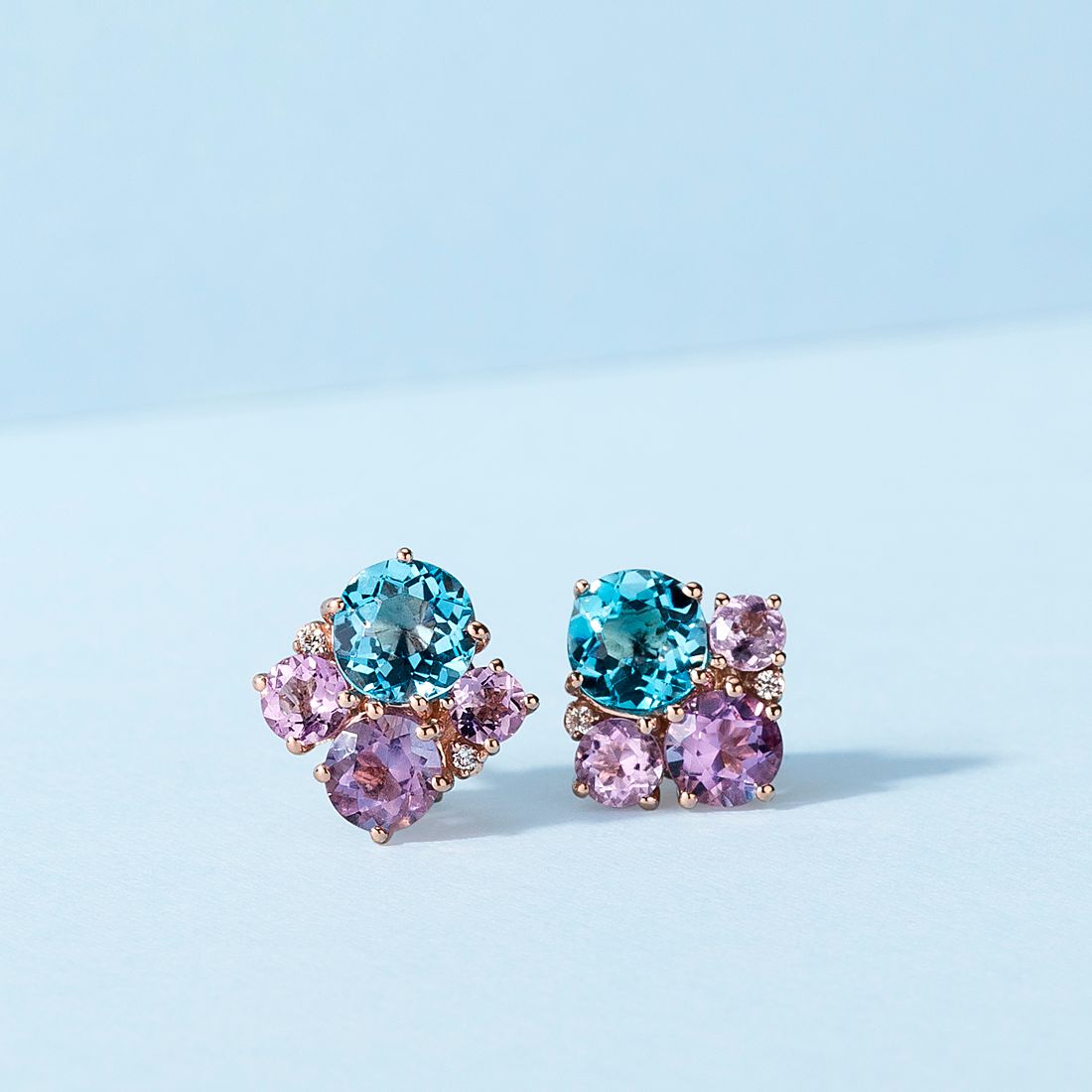 14k rose gold stud earrings with blue topaz, diamonds and amethyst.