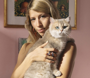 A portrait of Bea and her cat in the studio.