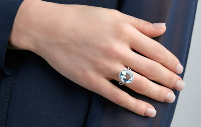 Aquamarine ring on a woman's hand.