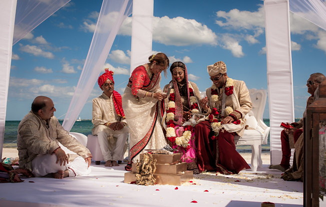 A traditional Indian wedding ceremony on the beach at Villa Del Palmar Cancun