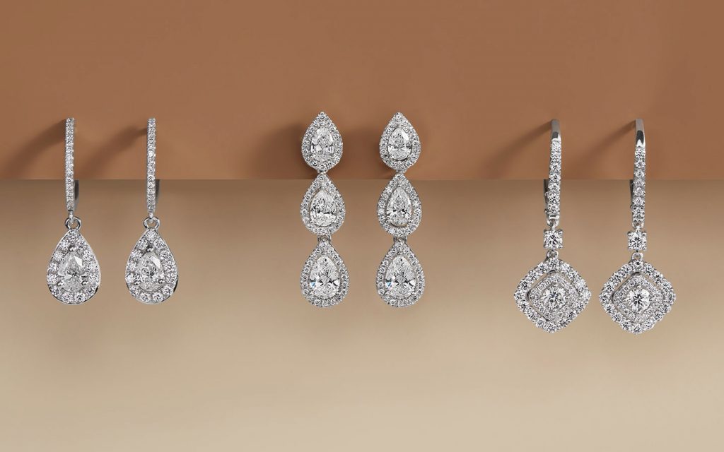 Three pairs of diamond and white gold dangling earrings.