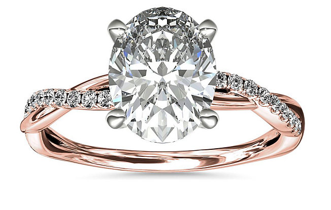 Rose gold engagement ring with oval diamond.