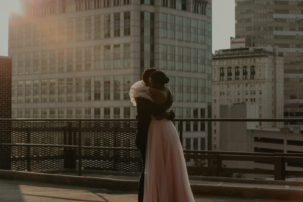 Bride and groom sharing a hug during their city elopement