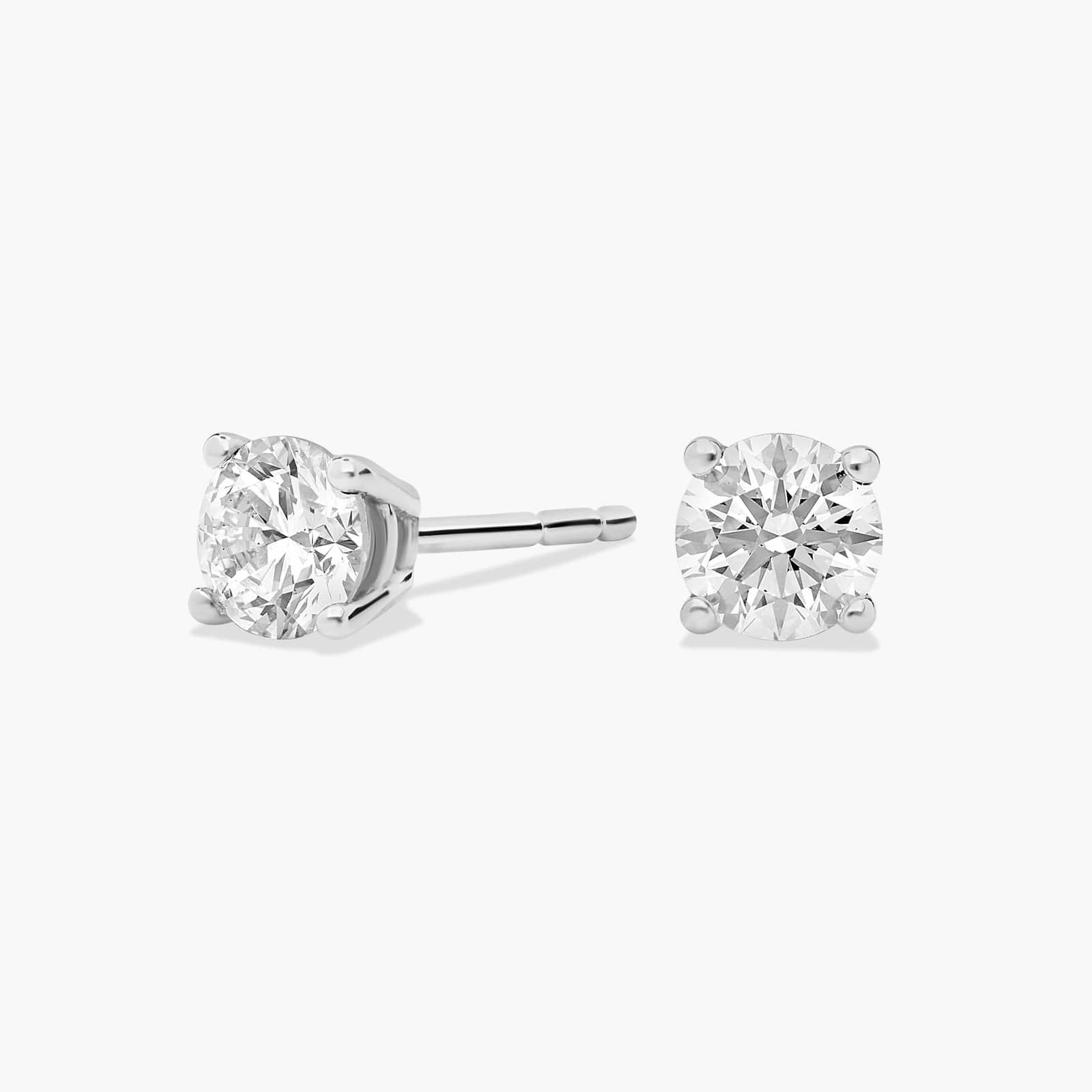 Four Prong Round Brilliant Diamond Stud Earrings In Platinum