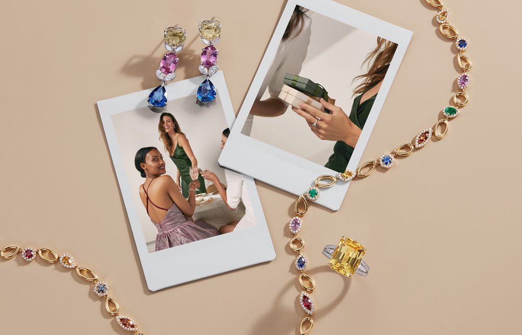 Flatlay of gemstone jewelry and Polaroid-style photos of holiday gift exchanges.