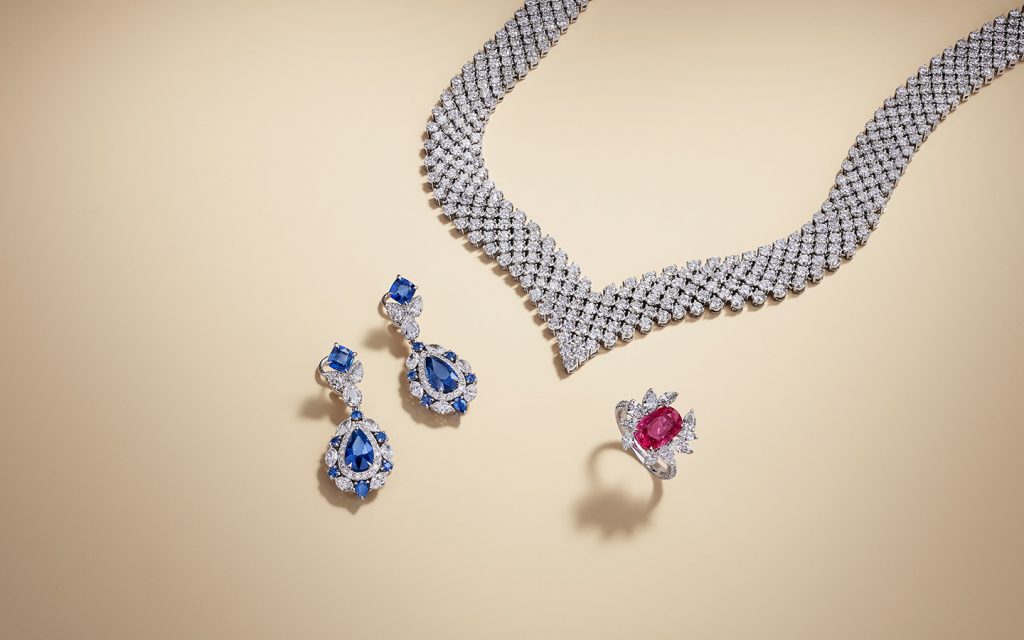 Diamond necklace, sapphire and diamond earrings and a ruby diamond ring.