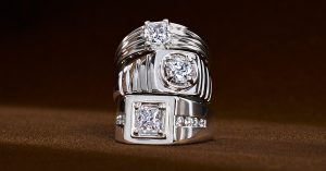 Stack of three men’s engagement rings with white gold and diamonds.