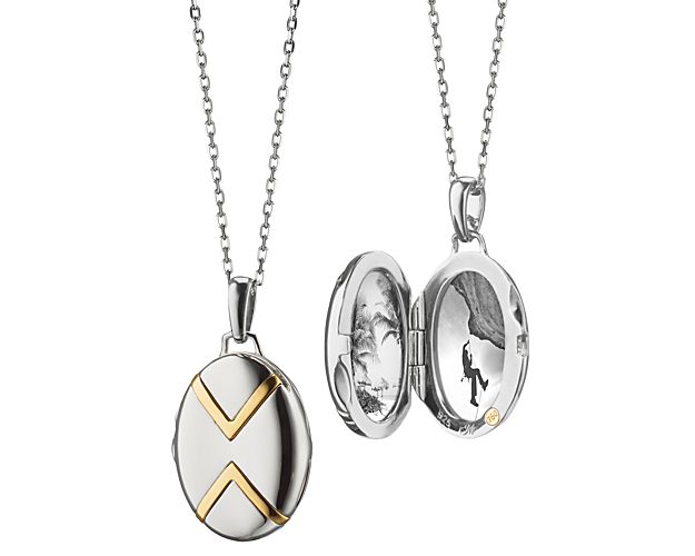 Mixed metal silver and gold locket with black and white photos inside.