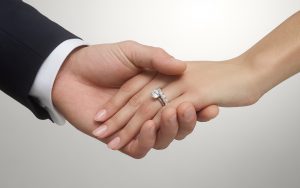 Bride and groom holding hands