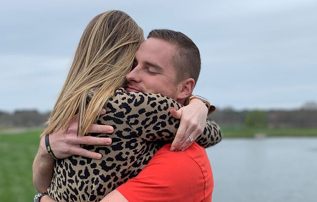 Phot of a man and woman hugging 