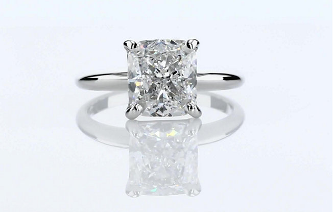 3 carat elongated cushion cut diamond engagement ring with mirrored reflection