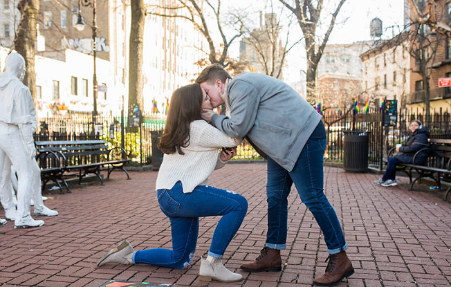 Couple kisses in public part during engagement proposal