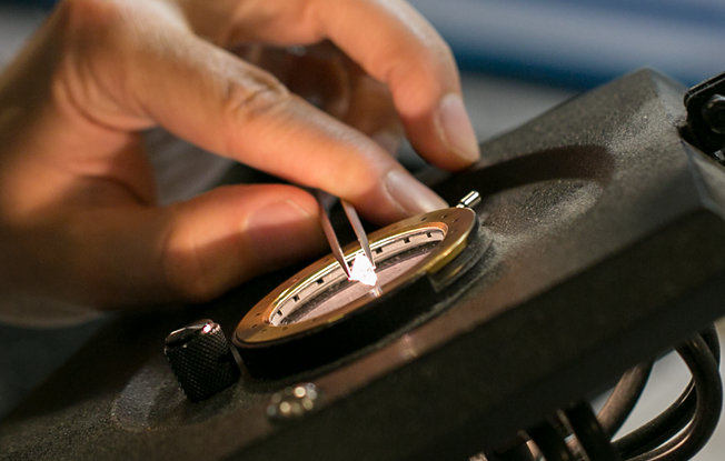 Gemologist inspecting a diamond.