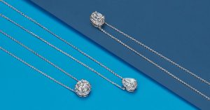 White gold and diamond solitaire necklaces with round oval and pear diamonds. 