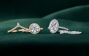 Gold and diamond engagement rings and wedding bands with oval and round diamonds.