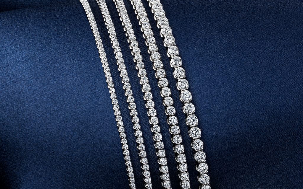 Five tennis bracelets in varying carat weights. 