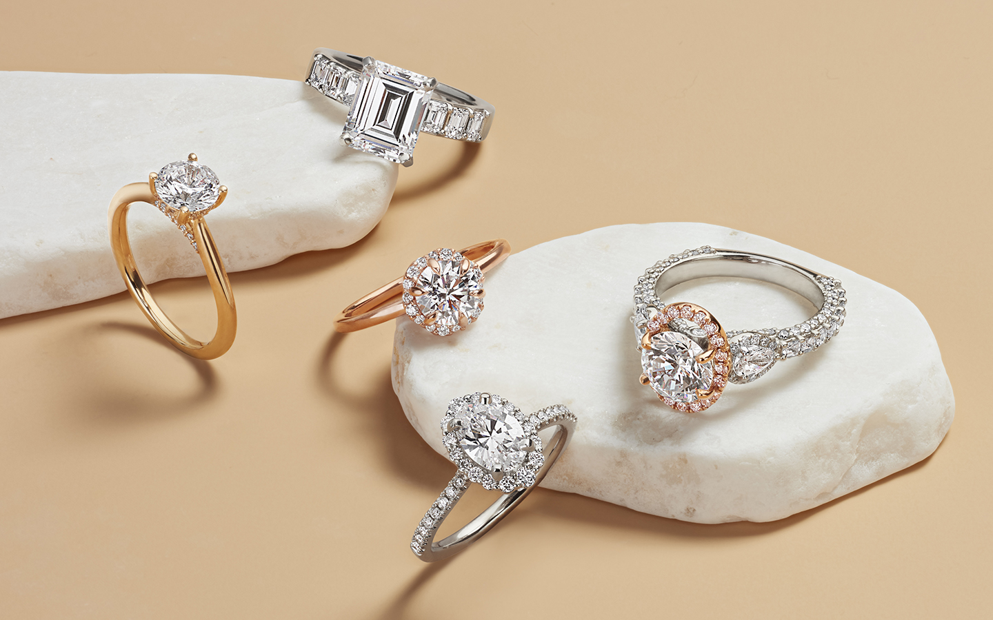 Five engagement rings including white gold, rose gold and platinum rings with diamonds.