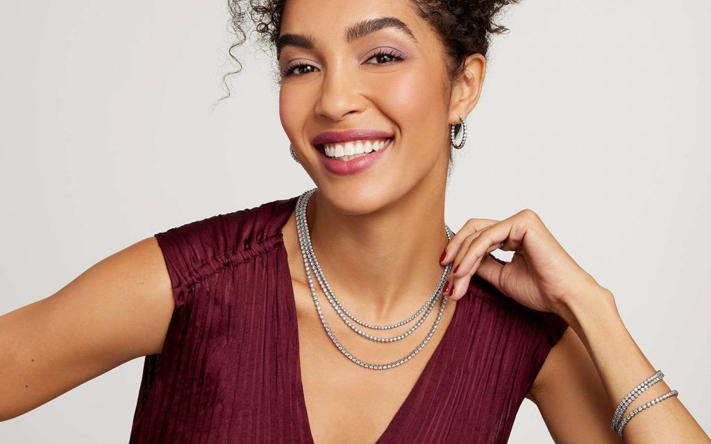 Woman smiling in diamond jewelry