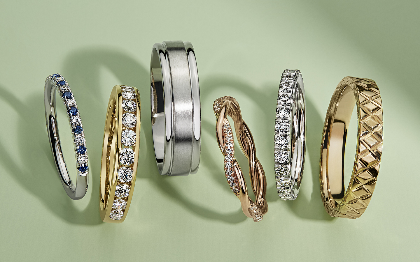 Six men's and women’s wedding bands including eternity, diamond, gold and gemstone rings.