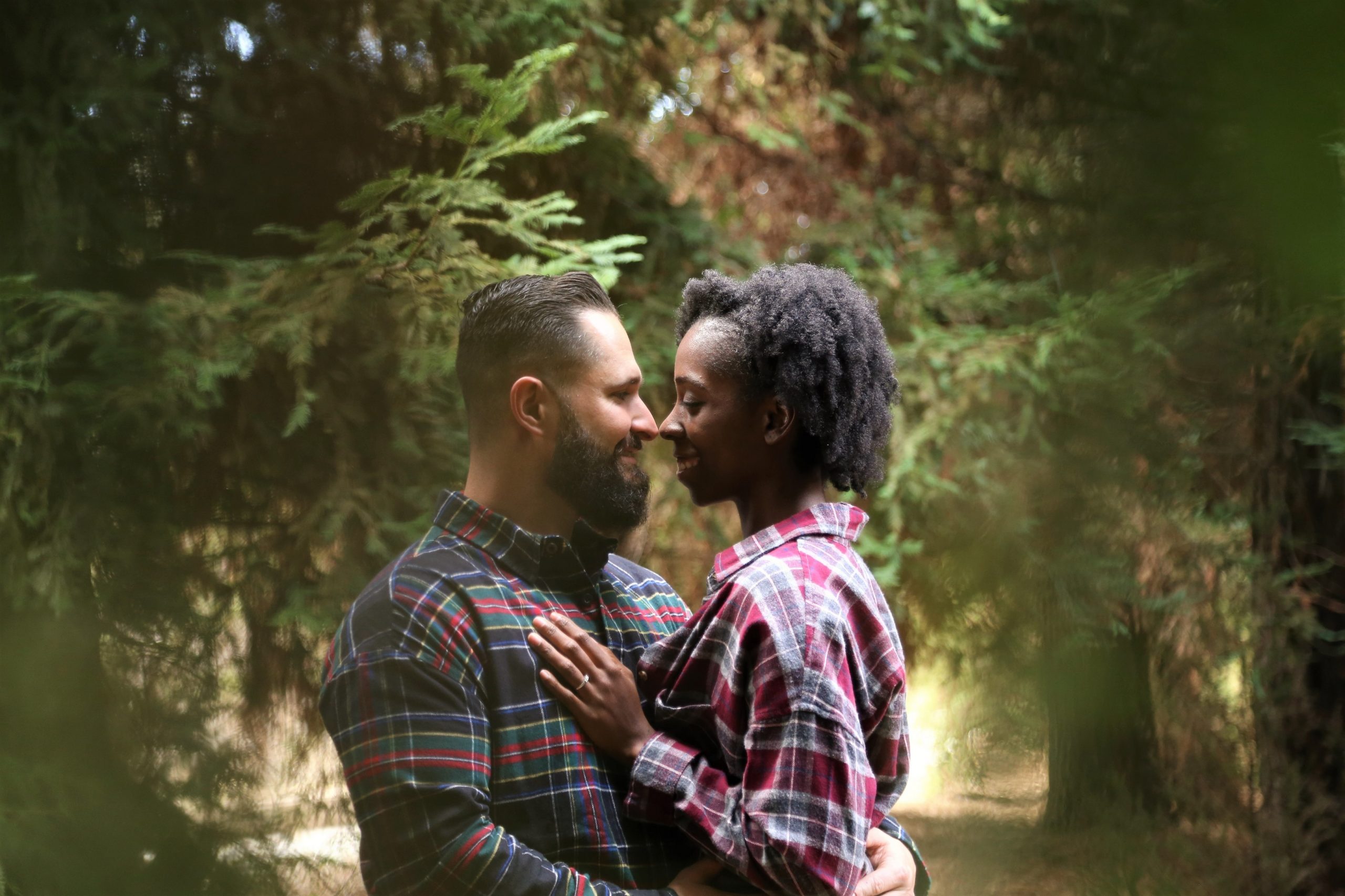 Engaged couple hugging.