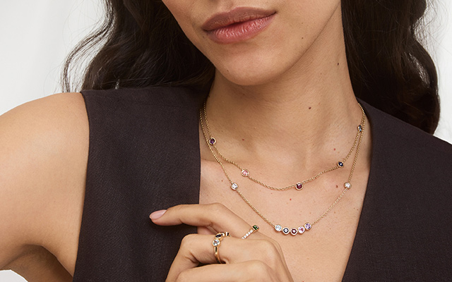 Woman wearing custom birthstone jewelry