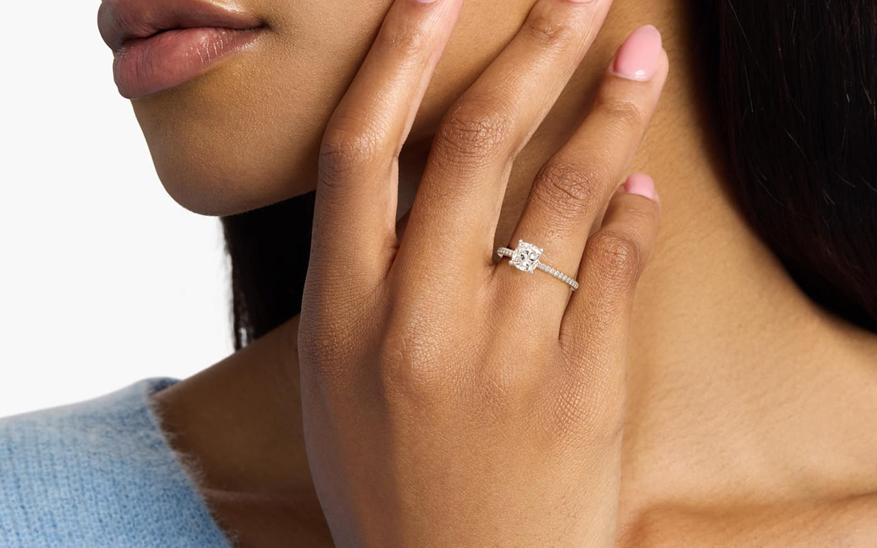 Person wearing a cushion cut ring
