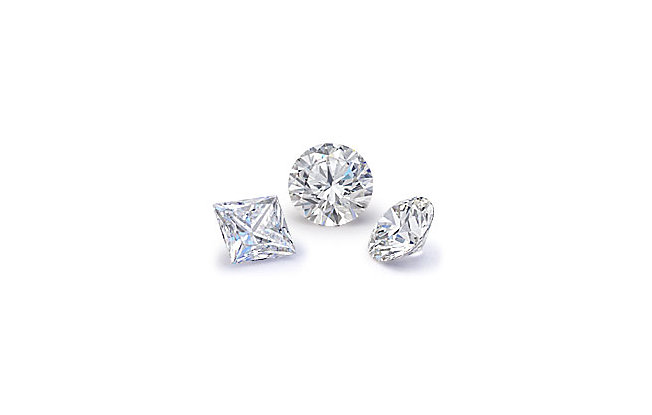 One round, and two round single diamonds on a white background
