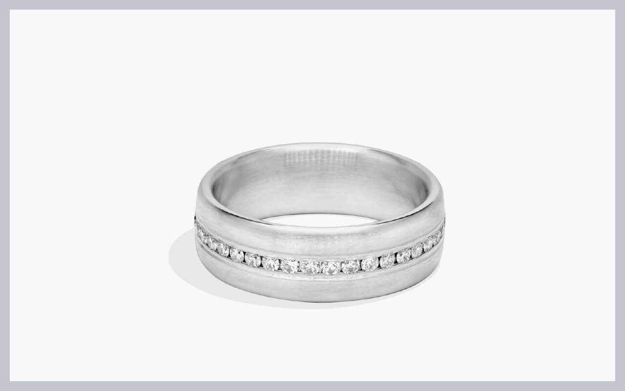 A diamond wedding ring with a satin finish
