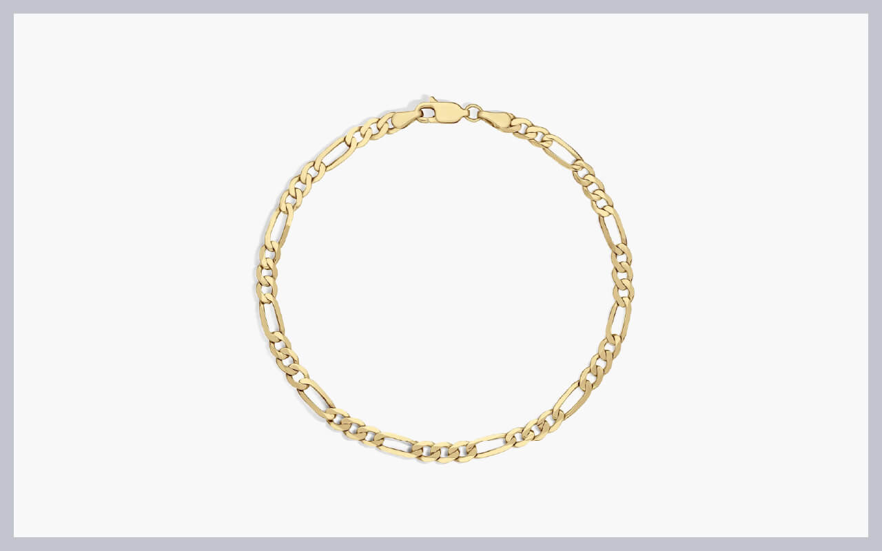 A close-up of an 8-inch flat figaro chain bracelet