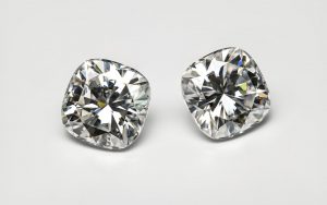 Old mine cut diamonds displayed on a grey background