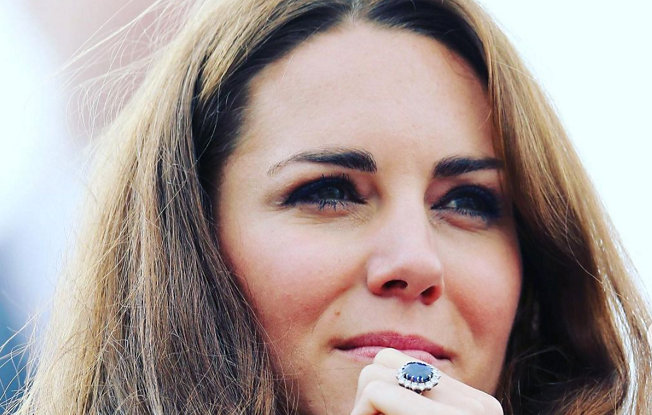 A close up of Kate Middleton wearing her sapphire engagement ring