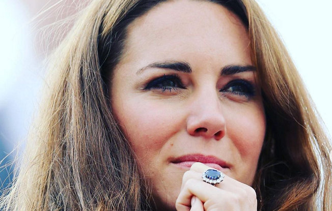 A close up of Kate Middleton wearing her saphhire engagement ring