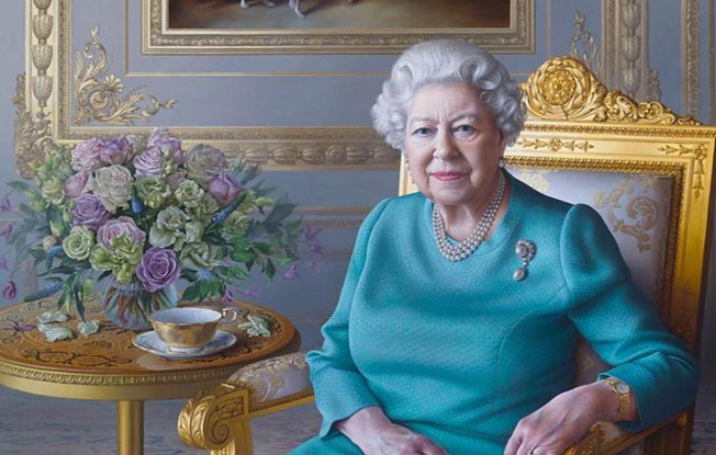 A portrait of Queen Elizabeth wearing a blue suit and her three strand pearl necklace