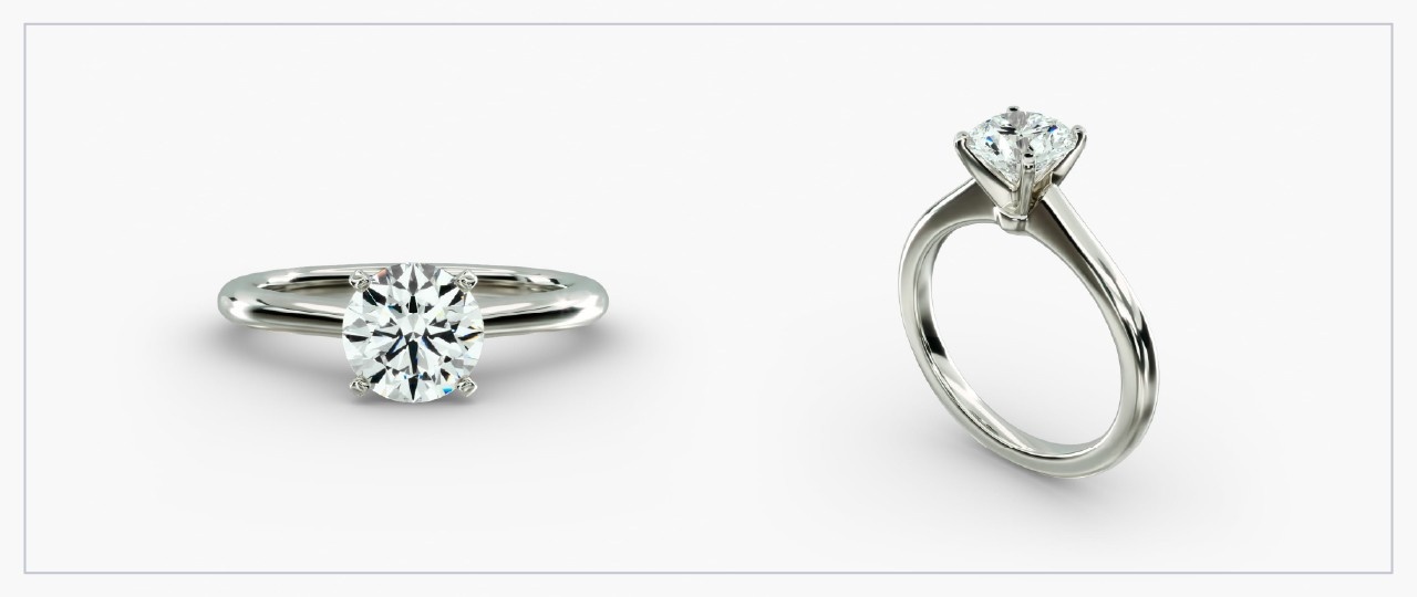 Front and side views of a white gold diamond solitaire ring