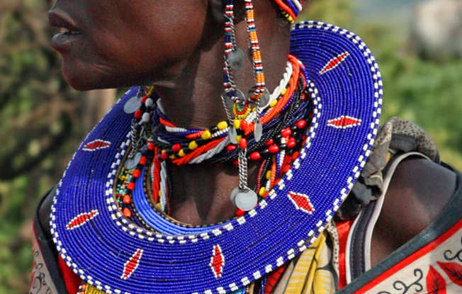 A Kenyan woman wearing traditional beaded tribal jewelry