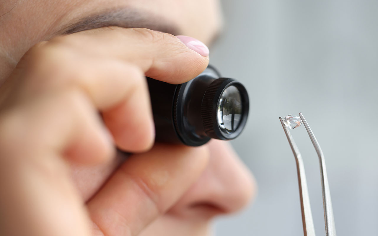 Jeweler looking closely at a diamond