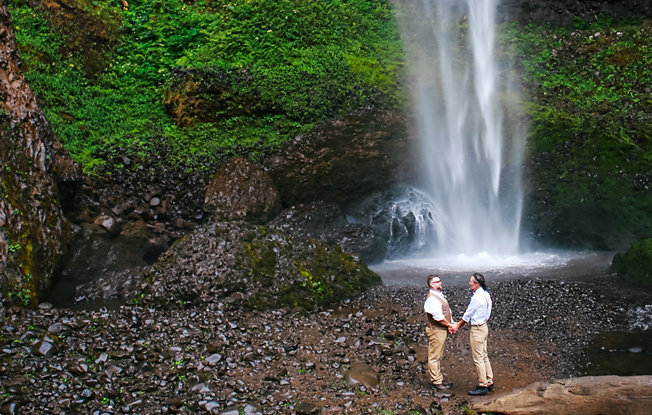 Two grooms sharing an embrace during their elopement.