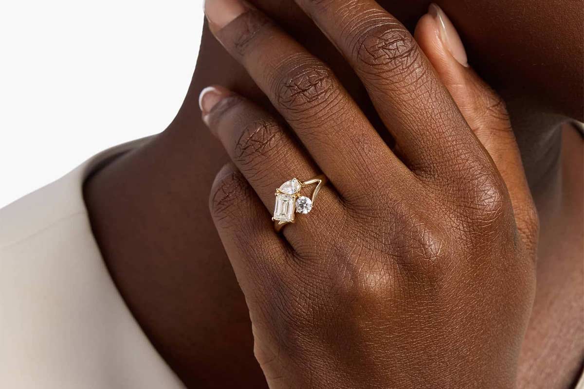 Close up photo of someone wearing a cluster ring
